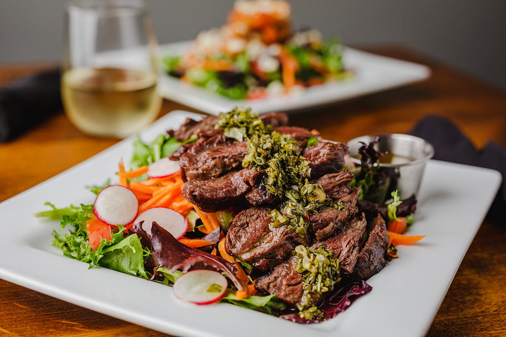 Steak and salad with wine